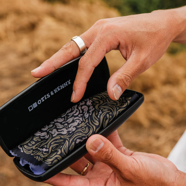 Artist Kentaro Yoshida opening sunglasses case and microfibre cloth