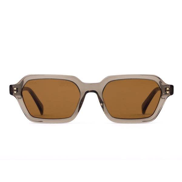 Sunglasses with a green transparent frame and brown lenses on a white background