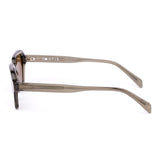 Sunglasses with a green transparent frame and brown lenses on a white background
