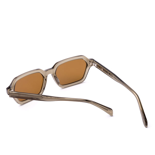 Sunglasses with a green transparent frame and brown lenses on a white background