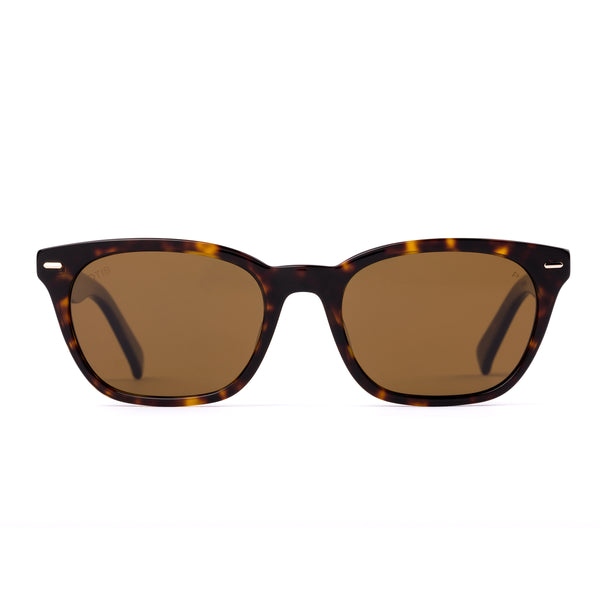 Sunglasses with tortoiseshell frame and brown lenses on a white background