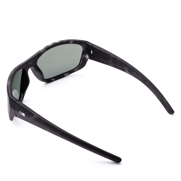 Black sunglasses with green lenses on a white background