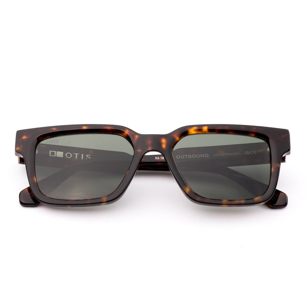 Square sunglasses with a tortoiseshell frame and grey lenses on a white background