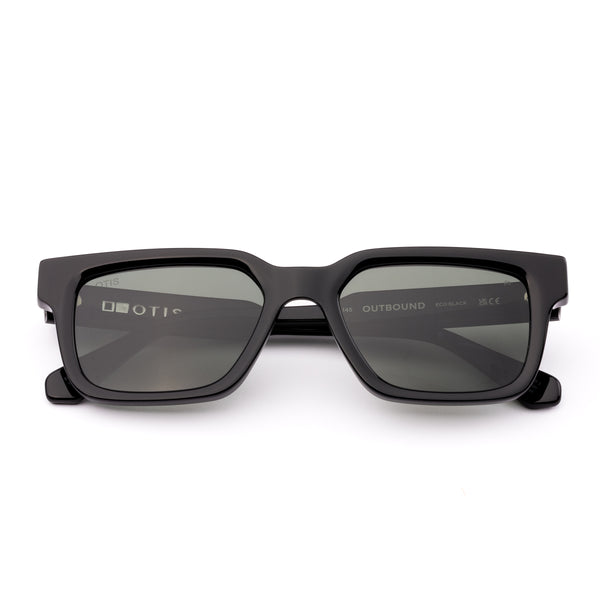 Black sunglasses with dark lenses on a white background
