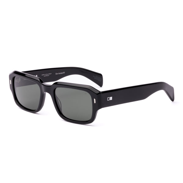 Square sunglasses with a black frame and grey lenses on a white background