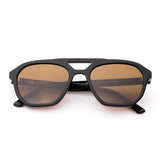 Aviator sunglasses with brown lenses and black frame on a white background.