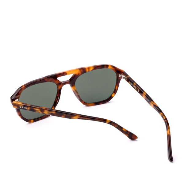 Aviator sunglasses with tortoiseshell frame and dark lenses on a white background