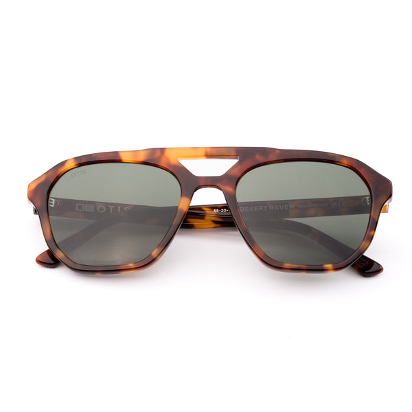 Aviator sunglasses with tortoiseshell frame and dark lenses on a white background