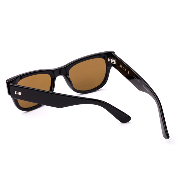 Black wayfarer sunglasses with brown lenses on a white background