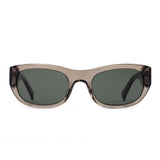 Sunglasses with a green transparent frame and dark lenses on a white background