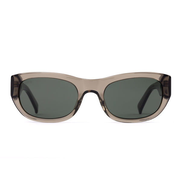 Sunglasses with a green transparent frame and dark lenses on a white background