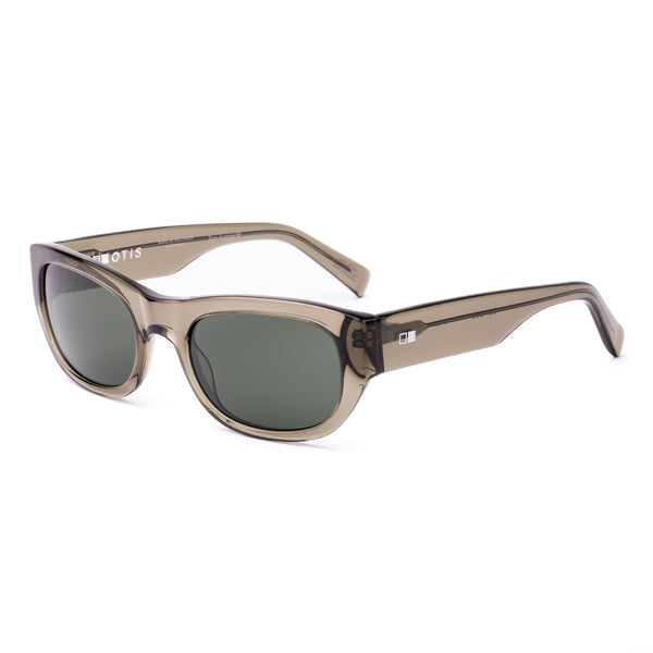 Sunglasses with a green transparent frame and dark lenses on a white background