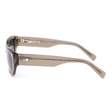 Sunglasses with a green transparent frame and dark lenses on a white background
