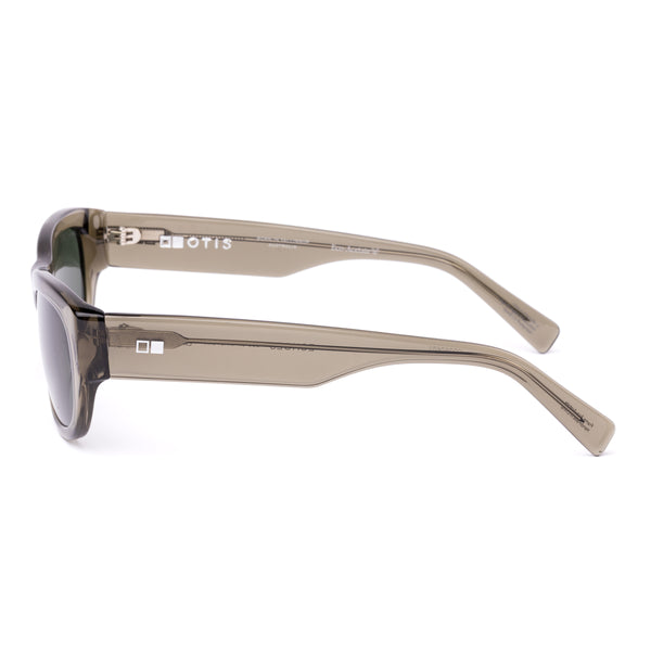 Sunglasses with a green transparent frame and dark lenses on a white background