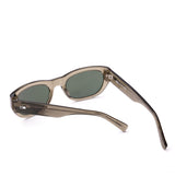 Sunglasses with a green transparent frame and dark lenses on a white background
