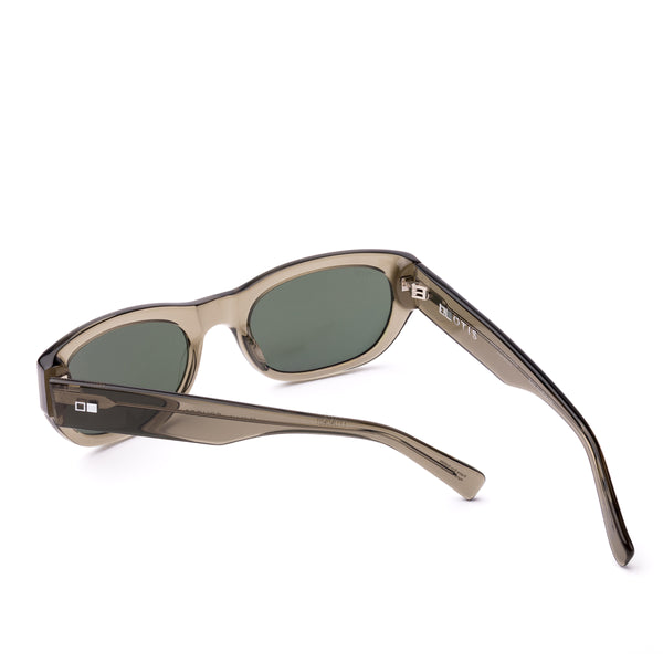 Sunglasses with a green transparent frame and dark lenses on a white background