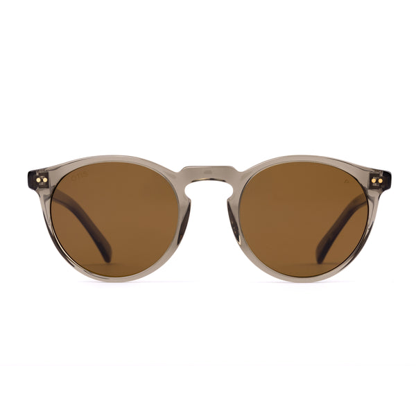 Round sunglasses with brown lenses on a white background