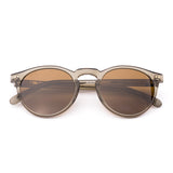 Round sunglasses with brown lenses on a white background