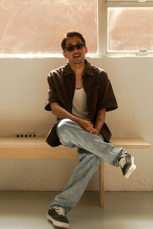 Kentaro Yoshida sitting down and talking about the sunglasses he made with OTIS eyewear