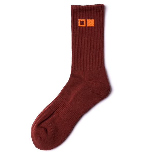 Brown sock with orange OTIS eyewear logo