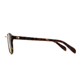 Round tort sunglasses with wire nose bridge from a side angle