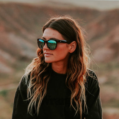 Woman wearing sunglasses in nature